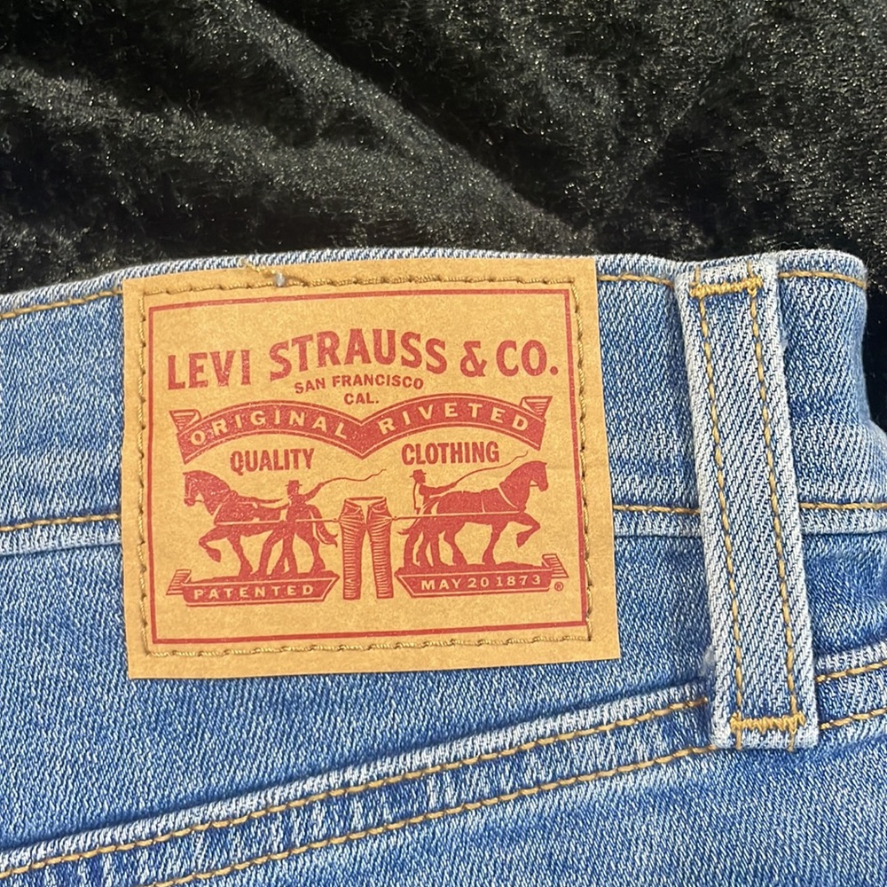High Rise Blue Ripped Levi Shorts - Picture 4 of 5